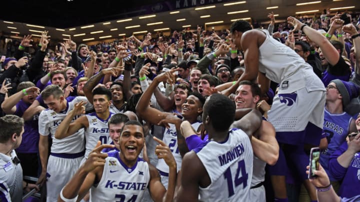 MANHATTAN, KS - JANUARY 16: Kansas State Wildcats players celebrate with students after defeating the Oklahoma Sooners on January 16, 2018 at Bramlage Coliseum in Manhattan, Kansas. (Photo by Peter G. Aiken/Getty Images)