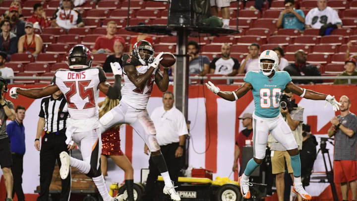 TAMPA, FLORIDA – AUGUST 16: Jamel Dean #35 of the Tampa Bay Buccaneers intercepts a pass thrown by Jake Rudock #5 intended for Saeed Blacknall #80 of the Miami Dolphins during the fourth quarter of a preseason football game at Raymond James Stadium on August 16, 2019 in Tampa, Florida. (Photo by Julio Aguilar/Getty Images)