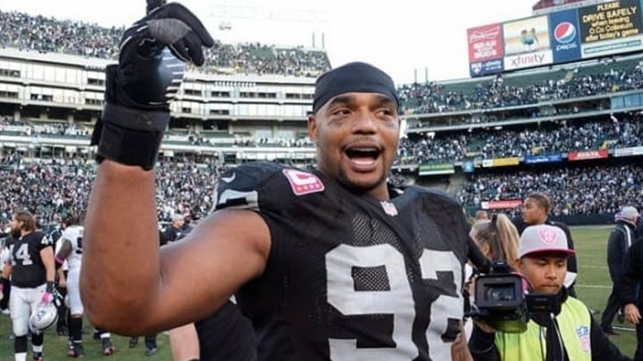 Oct 21, 2012; Oakland, CA, USA; Oakland Raiders defensive tackle Richard Seymour (92) reacts after the game against the Jacksonville Jaguars at O.co Coliseum. The Raiders defeated the Jaguars in overtime 26-23. Mandatory Credit: Kirby Lee/Image of Sport-USA TODAY Sports