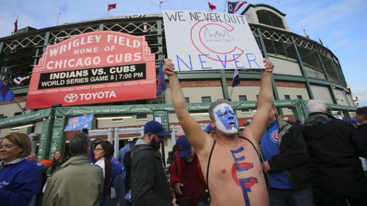 Oct 30, 2016; Chicago, IL, USA; Chicago Cubs fan Jason Gilley holds a sign outside Wrigley Field before game four of the 2016 World Series against the Cleveland Indians. Mandatory Credit: Jerry Lai-USA TODAY Sports