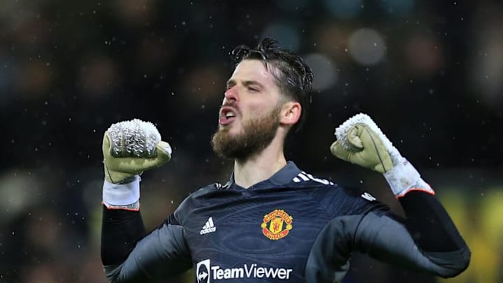 NORWICH, ENGLAND - DECEMBER 11: David De Gea of Manchester United celebrates victory during the Premier League match between Norwich City and Manchester United at Carrow Road on December 11, 2021 in Norwich, England. (Photo by Stephen Pond/Getty Images)