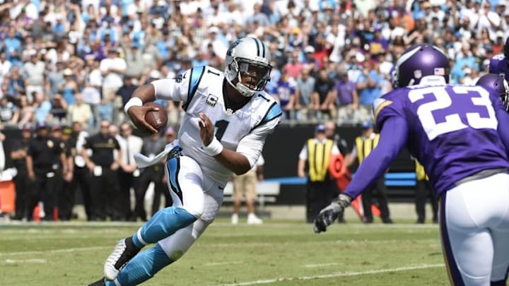 Sep 25, 2016; Charlotte, NC, USA; Carolina Panthers quarterback Cam Newton (1) scores a touchdown as Minnesota Vikings running back Ronnie Hillman (23) defends in the first quarter at Bank of America Stadium. Mandatory Credit: Bob Donnan-USA TODAY Sports