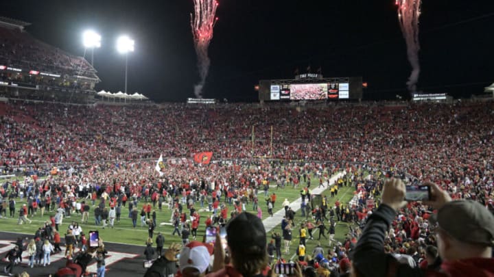 Oct 7, 2023; Louisville, Kentucky, USA; Louisville Cardinals fans flood the field in celebration after time expired against the Notre Dame Fighting Irish at L&N Federal Credit Union Stadium. Louisville defeated Notre Dame 33-20. Mandatory Credit: Jamie Rhodes-USA TODAY Sports