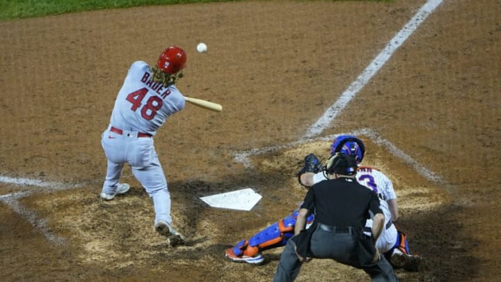 Sep 13, 2021; New York City, New York, USA; St. Louis Cardinals center fielder Harrison Bader (48) hits and RBI single against the New York Mets during the ninth inning at Citi Field. Mandatory Credit: Gregory Fisher-USA TODAY Sports