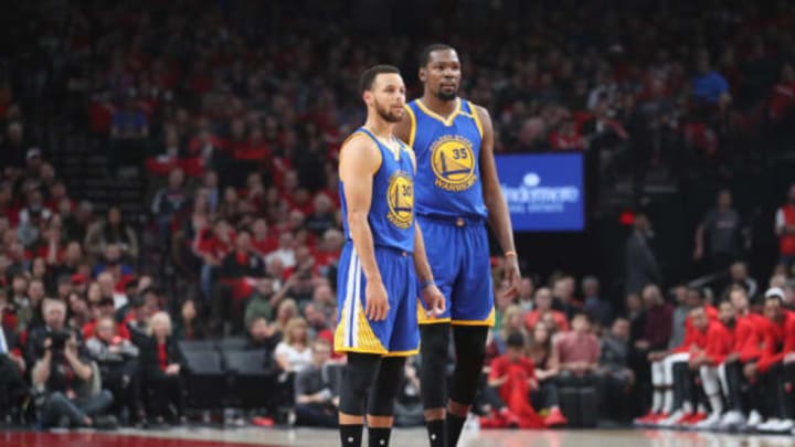 Apr 24, 2017; Portland, OR, USA; Golden State Warriors guard Stephen Curry (30) and forward Kevin Durant (35) look on from the court in the first half of game four of the first round of the 2017 NBA Playoffs at Moda Center. Mandatory Credit: Jaime Valdez-USA TODAY Sports
