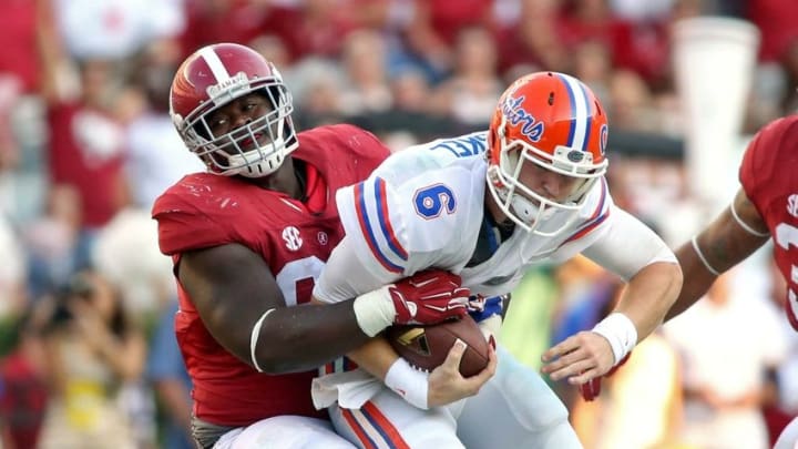 Sep 20, 2014; Tuscaloosa, AL, USA; Alabama Crimson Tide defensive lineman Jarran Reed (90) sacks Florida Gators quarterback Jeff Driskel (6) in the fourth quarter of their game at Bryant-Denny Stadium. Alabama won 42-21. Mandatory Credit: Jason Getz-USA TODAY Sports