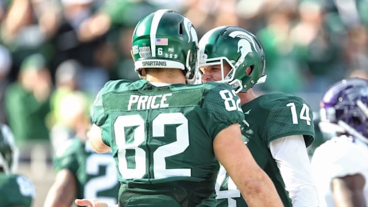 Oct 15, 2016; East Lansing, MI, USA; Michigan State Spartans tight end Josiah Price (82) celebrates a touchdown with Michigan State Spartans quarterback Brian Lewerke (14) during the first quarter of a game against the Northwestern Wildcats at Spartan Stadium. Mandatory Credit: Mike Carter-USA TODAY Sports
