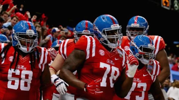 NEW ORLEANS, LA - JANUARY 01: Laremy Tunsil #78 of the Mississippi Rebels celebrate his touchdown with teammates during the second quarter against the Oklahoma State Cowboys in the Allstate Sugar Bowl at Mercedes-Benz Superdome on January 1, 2016 in New Orleans, Louisiana. (Photo by Chris Graythen/Getty Images)