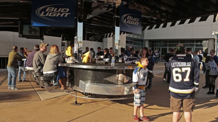 ST. LOUIS, MO - APRIL 25: St. Louis Blues fans mingle around a portable bar prior to an NHL game between the St. Louis Blues and the Calgary Flames on April 25, 2013 at Scottrade Center in St. Louis, Missouri. (Photo by Mark Buckner/NHLI via Getty Images)