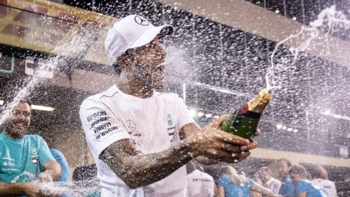 ABU DHABI, UNITED ARAB EMIRATES - NOVEMBER 25: Race winner Lewis Hamilton of Great Britain and Mercedes GP celebrates with his team after the Abu Dhabi Formula One Grand Prix at Yas Marina Circuit on November 25, 2018 in Abu Dhabi, United Arab Emirates. (Photo by Lars Baron/Getty Images)