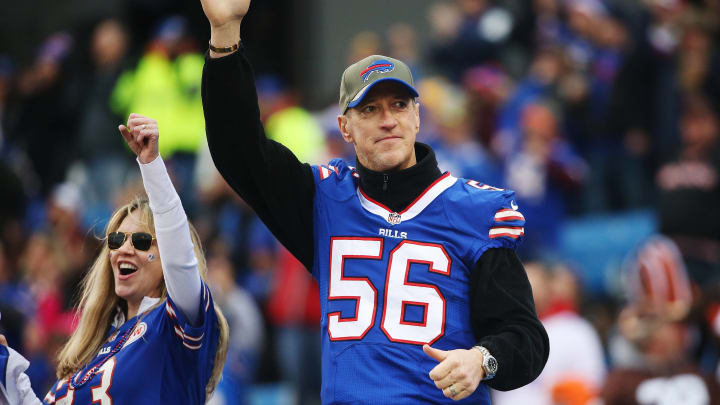 ORCHARD PARK, NY – NOVEMBER 30: Former Buffalo Bills quarterback Jim Kelly, wearing the former jersey of Darryl Talley, acknowledges the crowd before the game against the Cleveland Browns at Ralph Wilson Stadium on November 30, 2014 in Orchard Park, New York. (Photo by Tom Szczerbowski/Getty Images)