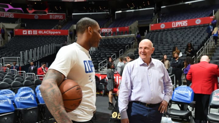 LOS ANGELES, CA - JANUARY 1: Sindarius Thornwell #0 and owner Steve Ballmer of the LA Clippers talk before the game against the Philadelphia 76ers on January 1, 2019 at STAPLES Center in Los Angeles, California. NOTE TO USER: User expressly acknowledges and agrees that, by downloading and/or using this photograph, user is consenting to the terms and conditions of the Getty Images License Agreement. Mandatory Copyright Notice: Copyright 2019 NBAE (Photo by Andrew D. Bernstein/NBAE via Getty Images)