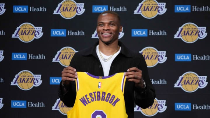 Aug 10, 2021; Los Angeles, California, USA; Russell Westbrook poses with Los Angeles Lakers jersey at press conference at Staples Center. Mandatory Credit: Kirby Lee-USA TODAY Sports
