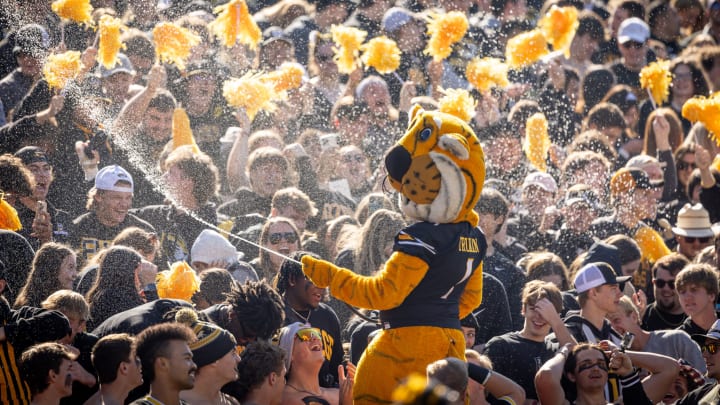 Missouri Tigers mascot Truman sprays water into the student section