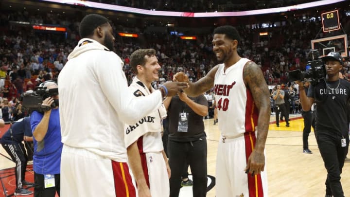 The Miami Heat's, from left, Willie Reed, Goran Dragic and Udonis Haslem celebrate 110-102 win against the Washington Wizards at AmericanAirlines Arena in Miami on Wednesday, April 12, 2017. (David Santiago/El Nuevo Herald/TNS via Getty Images)