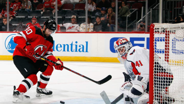 NEWARK, NEW JERSEY - OCTOBER 04: Tomas Tatar #90 of the New Jersey Devils is stopped by Vitek Vanecek #41 of the Washington Capitals during the second period in a preseason game at the Prudential Center on October 04, 2021 in Newark, New Jersey. (Photo by Bruce Bennett/Getty Images)