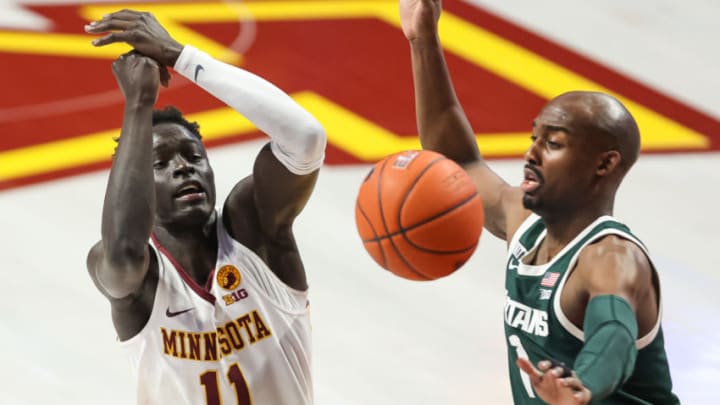 Dec 28, 2020; Minneapolis, Minnesota, USA; Michigan State Spartans guard Joshua Langford (1) knocks the ball away from Minnesota Gophers guard Both Gach (11) during the first half at Williams Arena. Mandatory Credit: Harrison Barden-USA TODAY Sports