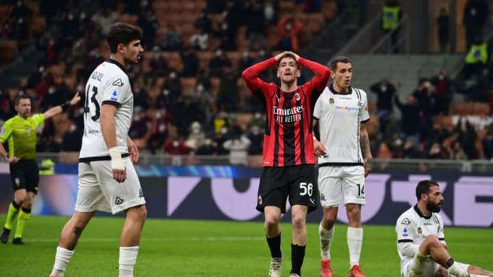 AC Milan's Belgian midfielder Alexis Saelemaekers (C) reacts after missing a goal opportunity during the Italian Serie A football match between AC Milan and Spezia on January 17, 2022 at the San Siro stadium in Milan. (Photo by MIGUEL MEDINA / AFP) (Photo by MIGUEL MEDINA/AFP via Getty Images)