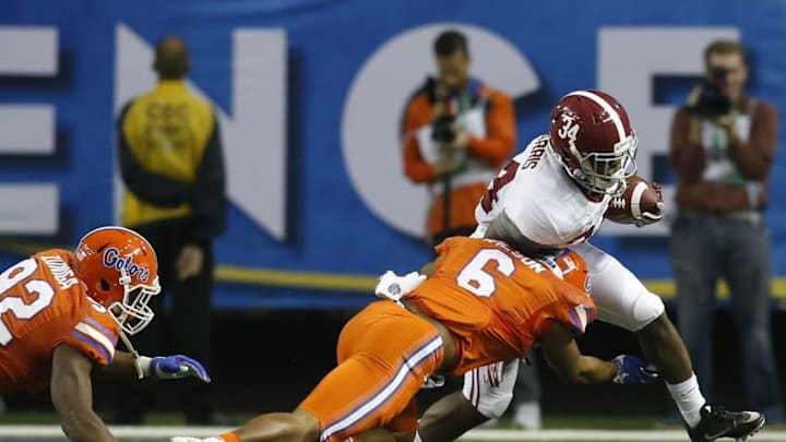 Dec 3, 2016; Atlanta, GA, USA; Alabama Crimson Tide running back Damien Harris (34) runs against Florida Gators defensive back Quincy Wilson (6) during the second quarter of the SEC Championship college football game at Georgia Dome. Mandatory Credit: Brett Davis-USA TODAY Sports