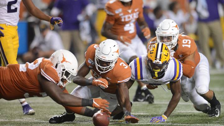 AUSTIN, TX - SEPTEMBER 07: The Texas Longhorns defense swarms on a loose ball during the Texas Longhorns game against the LSU Tigers on September 7, 2019, at Darrell K Royal-Texas Memorial Stadium in Austin, Texas. (Photo by John Rivera/Icon Sportswire via Getty Images)