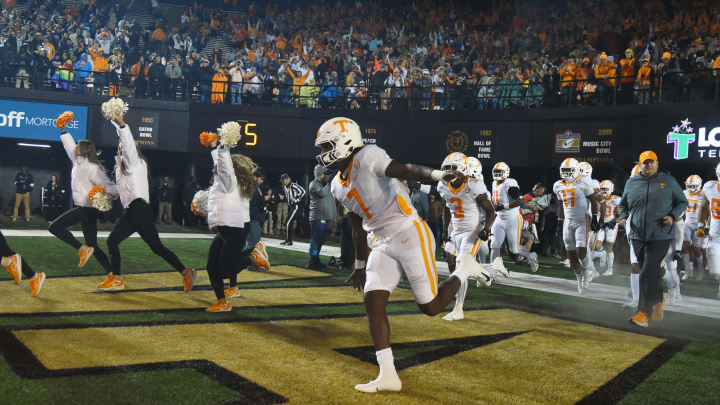 Nov 26, 2022; Nashville, Tennessee, USA; Tennessee Volunteers quarterback Joe Milton III (7) leads players onto the field before the game against the Vanderbilt Commodores at FirstBank Stadium. Mandatory Credit: Christopher Hanewinckel-USA TODAY Sports