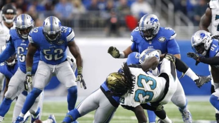 Nov 20, 2016; Detroit, MI, USA; Jacksonville Jaguars running back Chris Ivory (33) fumbles the ball against Detroit Lions free safety Glover Quin (27) and outside linebacker Antwione Williams (52) during the second quarter at Ford Field. Mandatory Credit: Raj Mehta-USA TODAY Sports