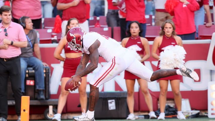 Oct 1, 2022; Fayetteville, Arkansas, USA; Alabama Crimson Tide quarterback Jalen Milroe (4) goes out of bounds before reaching the pylon in the fourth quarter against the Arkansas Razorbacks at Donald W. Reynolds Razorback Stadium. Alabama won 49-26. Mandatory Credit: Nelson Chenault-USA TODAY Sports