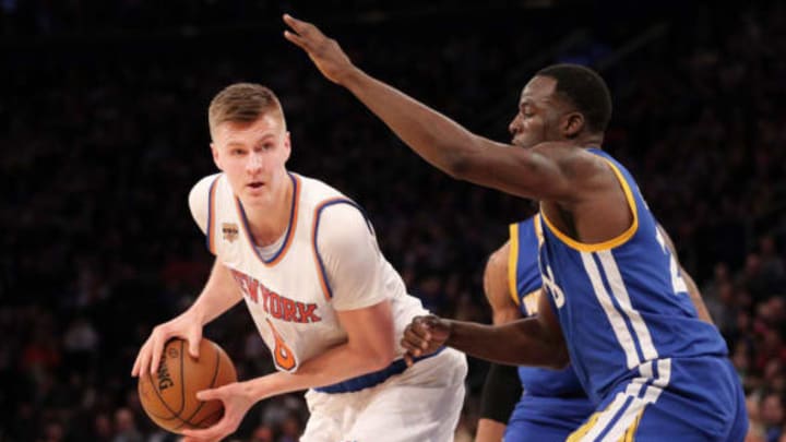 Mar 5, 2017; New York, NY, USA; New York Knicks power forward Kristaps Porzingis (6) controls the ball against Golden State Warriors power forward Draymond Green (23) during the fourth quarter at Madison Square Garden. Mandatory Credit: Brad Penner-USA TODAY Sports