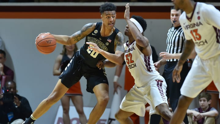 Mar 4, 2017; Blacksburg, VA, USA; Wake Forest Demon Deacons forward John Collins (20) dribbles towards the basket while being defended by Virginia Tech Hokies forward Zach LeDay (32) in the second half at Cassell Coliseum. Mandatory Credit: Michael Shroyer-USA TODAY Sports