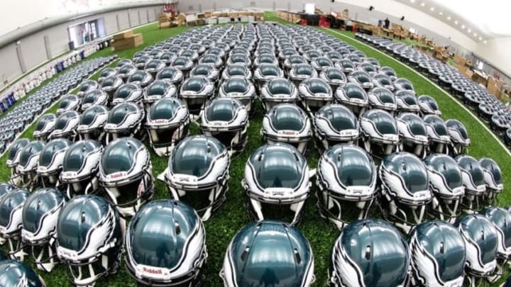 May 24, 2016; Philadelphia, PA, USA; Philadelphia Eagles helmets lined up on the indoor turf during OTA