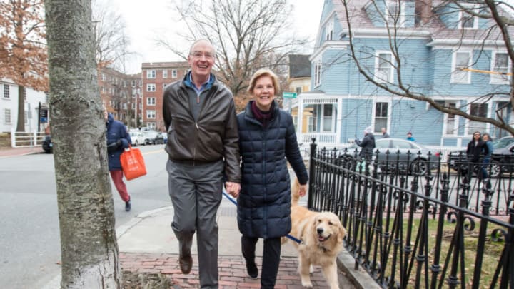 CAMBRIDGE, MA - DECEMBER 31: Sen. Elizabeth Warren (D-MA), her husband Bruce Mann and dog Bailey walk back to their home after Warren addressed the media following her announcement that she formed an exploratory committee for a 2020 Presidential run on December 31, 2018 in Cambridge, Massachusetts. Warren is one of the earliest potential candidates to make an official announcement in what is expected to be a very large Democratic field. (Photo by Scott Eisen/Getty Images)