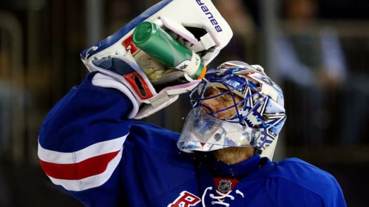 NEW YORK, NY - DECEMBER 23: Henrik Lundqvist #30 of the New York Rangers looks on during a break in play against the Washington Capitals during a game at Madison Square Garden on December 23, 2014 in New York City. (Photo by Alex Trautwig/Getty Images)
