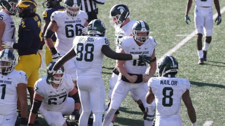 Michigan State Spartans quarterback Rocky Lombardi (12) celebrates after getting a first down to seal the 27-24 win over the Michigan Wolverines at Michigan Stadium in Ann Arbor, Saturday, Oct. 31, 2020.Michigan