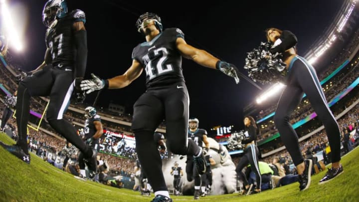 PHILADELPHIA, PA - OCTOBER 12: Malcolm Jenkins #27 and Chris Maragos #42 of the Philadelphia Eagles take the field before the stat of a football game against the New York Giants at Lincoln Financial Field on October 12, 2014 in Philadelphia, Pennsylvania. (Photo by Rich Schultz /Getty Images)