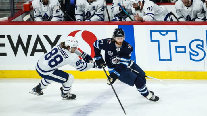 Apr 22, 2021; Winnipeg, Manitoba, CAN; Winnipeg Jets forward Kyle Connor (81) skates away from Toronto Maple Leafs forward William Nylander (88) during the second period at Bell MTS Place. Mandatory Credit: Terrence Lee-USA TODAY Sports