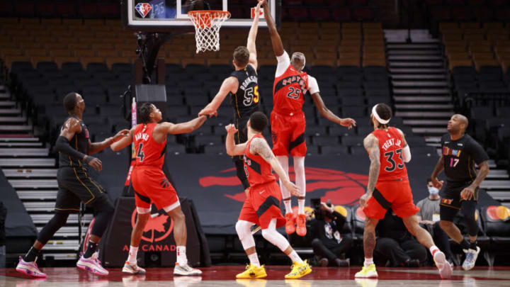 TORONTO, ON - FEBRUARY 01: Chris Boucher #25 of the Toronto Raptors blocks a shot from Duncan Robinson #55 of the Miami Heat (Photo by Cole Burston/Getty Images)