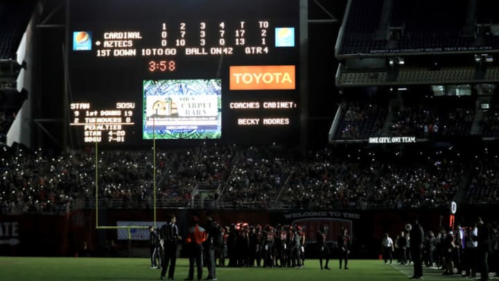 SAN DIEGO, CA - SEPTEMBER 16: Fans and players look on while half of the stadiums lights went out during the second half of a game between the San Diego State Aztecs and the Stanford Cardinal at Qualcomm Stadium on September 16, 2017 in San Diego, California. (Photo by Sean M. Haffey/Getty Images)
