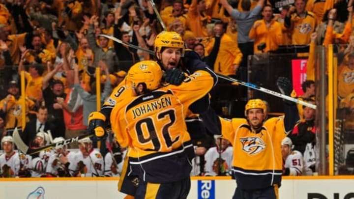 NASHVILLE, TN – APRIL 17: Filip Forsberg #9 of the Nashville Predators jumps into the arms of teammate Ryan Johansen #92 after scoring the game-tying goal against the Chicago Blackhawks during the third period in Game Three of the Western Conference First Round during the 2017 NHL Stanley Cup Playoffs at Bridgestone Arena on April 17, 2017 in Nashville, Tennessee. (Photo by Frederick Breedon/Getty Images)