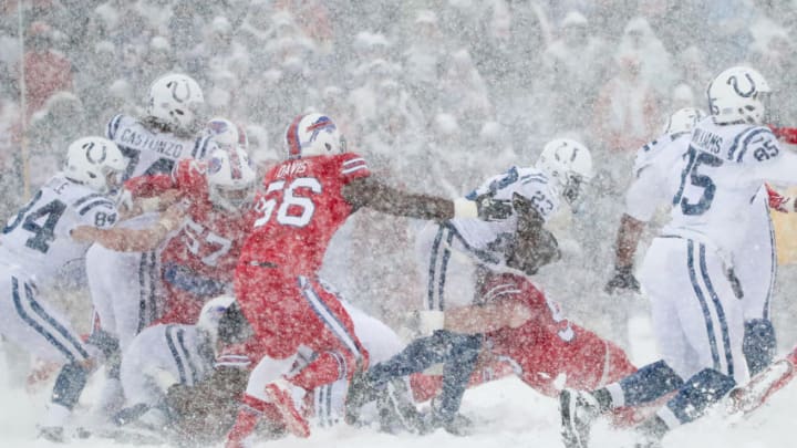 ORCHARD PARK, NY - DECEMBER 10: Frank Gore #23 of the Indianapolis Colts runs the ball as Kyle Williams #95 of the Buffalo Bills attempts to tackle him during the second quarter on December 10, 2017 at New Era Field in Orchard Park, New York. (Photo by Tom Szczerbowski/Getty Images)
