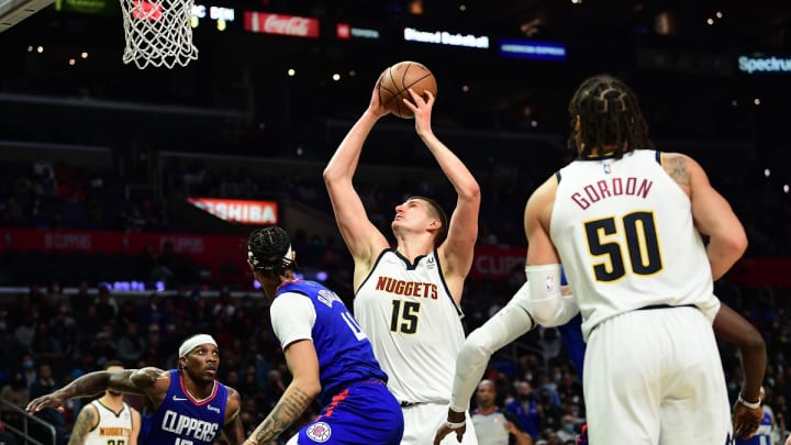 Jan 11, 2022; Los Angeles, California, USA; Denver Nuggets center Nikola Jokic (15) shoots agaisnt the Los Angeles Clippers during the second half at Crypto.com Arena. Mandatory Credit: Gary A. Vasquez-USA TODAY Sports Jan 11, 2022; Los Angeles, California, USA; Denver Nuggets center Nikola Jokic (15) shoots agaisnt the Los Angeles Clippers during the second half at Crypto.com Arena. Mandatory Credit: Gary A. Vasquez-USA TODAY Sports