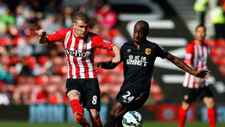 SOUTHAMPTON, ENGLAND - APRIL 11: Steven Davis of Southampton shoots past the challenge of Sone Aluko of Hull City during the Barclays Premier League match between Southampton and Hull City at St Mary's Stadium on April 11, 2015 in Southampton, England. (Photo by Steve Bardens/Getty Images)