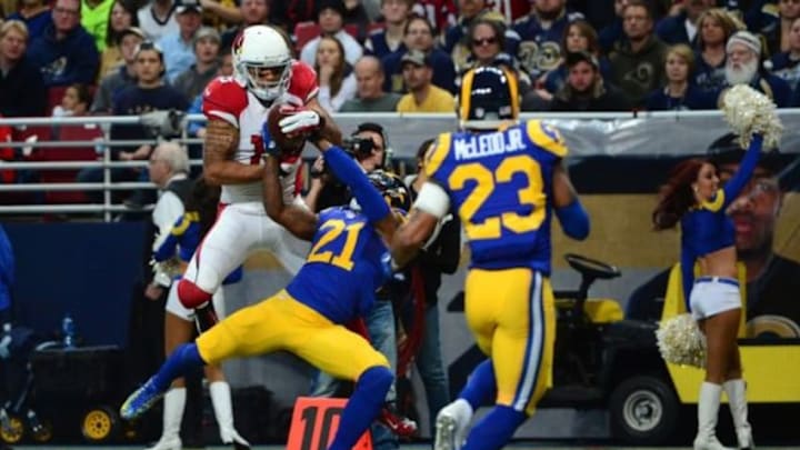 Dec 6, 2015; St. Louis, MO, USA; St. Louis Rams cornerback Janoris Jenkins (21) breaks up a pass intended for Arizona Cardinals wide receiver Michael Floyd (15) during the first half at the Edward Jones Dome. Mandatory Credit: Jeff Curry-USA TODAY Sports