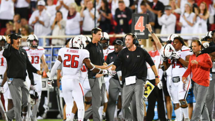 LUBBOCK, TX - SEPTEMBER 17: Texas Tech Red Raiders head coach Kliff Kingsbury reacts with defensive back Kevin Moore #26 of the Texas Tech Red Raiders after a fourth down stop during the game against the Louisiana Tech Bulldogs on September 17, 2016 at AT&T Jones Stadium in Lubbock, Texas. Texas Tech won the game 59-45. (Photo by John Weast/Getty Images)