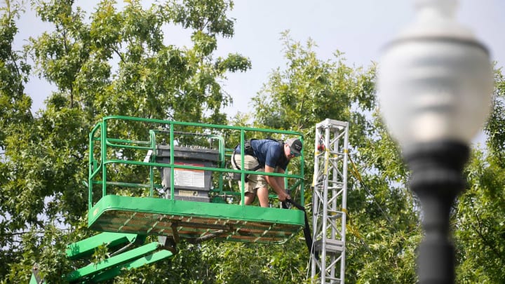 A worker builds a tower for the television set for ESPN’s College GameDay show in front of Ayres Hall in Knoxville, Tenn. on Thursday, Sept. 22, 2022. ESPN’s flagship college football pregame show is returning for the tenth time to Knoxville as the No. 12 Vols face the No. 22 Gators on Saturday. The show will air Saturday from 9 a.m. to noon ET.Kns College Gameday