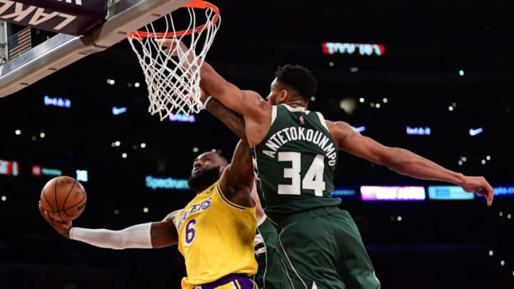 Feb 8, 2022; Los Angeles, California, USA; Los Angeles Lakers forward LeBron James (6) moves to the basket against Milwaukee Bucks forward Giannis Antetokounmpo (34) during the first half at Crypto.com Arena. Mandatory Credit: Gary A. Vasquez-USA TODAY Sports