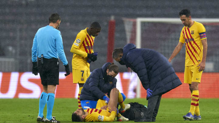 Barcelona's Jordi Alba lies injured on the pitch during the Champions League match against FC Bayern München at Football Arena Munich on December 08, 2021 in Munich, Germany. (Photo by Pedro Salado/Quality Sport Images/Getty Images)