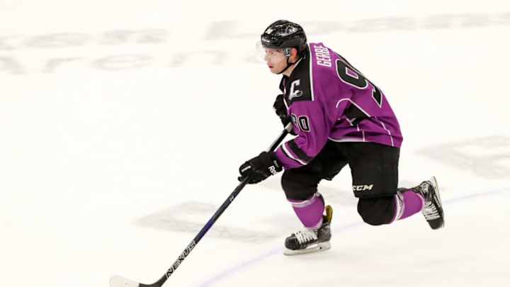 CLEVELAND, OH - MARCH 24: Cleveland Monsters center Nathan Gerbe (90) controls the puck during overtime of the American Hockey League game between the San Diego Gulls and Cleveland Monsters on March 24, 2018, at Quicken Loans Arena in Cleveland, OH. The Monsters wore purple jerseys for cancer awareness. San Diego defeated Cleveland 4-3 in overtime. (Photo by Frank Jansky/Icon Sportswire via Getty Images)