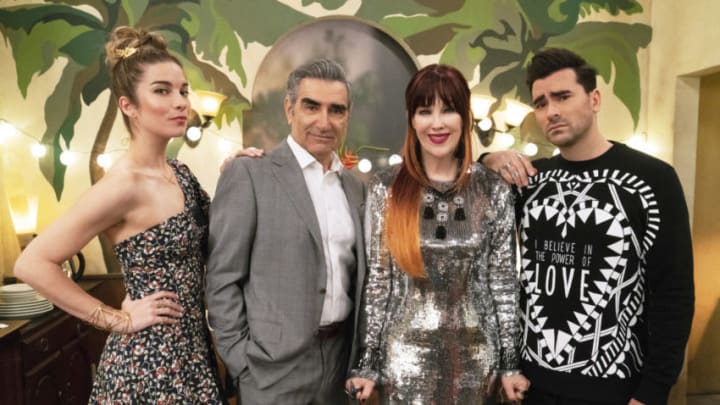 Schitt's Creek -- "Meet the Parents" -- Image Number: SCH511_0119.jpg -- Pictured (L-R): Annie Murphy as Alexis Rose, Eugene Levy as Johnny Rose, Catherine OHara as Moira Rose and Daniel Levy as David Rose -- Photo: 2020 Pop Media Group LLC.
