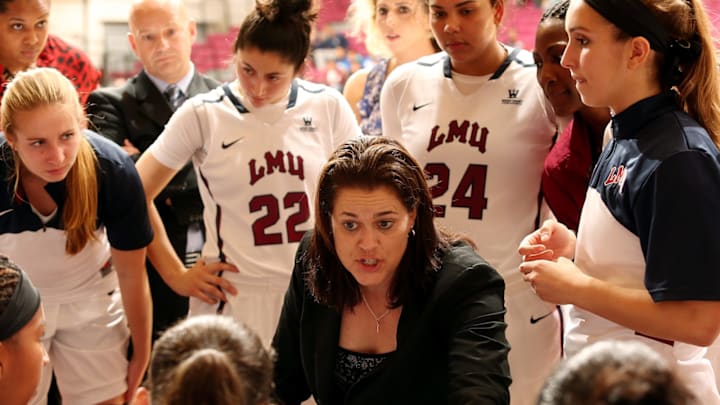 LOS ANGELES, CA – NOVEMBER 21: Head coach Charity Elliott of the Loyola Marymount Lions talks to her team during a timeout against the Cal Poly Mustangs in the second half of the home opening game at Gersten Pavilion on November 21, 2014 in Los Angeles, California. Cal Poly won 87-79. (Photo by Jeff Golden/Getty Images)