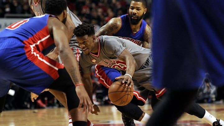Apr 2, 2016; Chicago, IL, USA; Chicago Bulls guard Jimmy Butler (21) drives against Detroit Pistons center Andre Drummond (0) and Detroit Pistons forward Marcus Morris (13) in the second half at the United Center. Mandatory Credit: Matt Marton-USA TODAY Sports